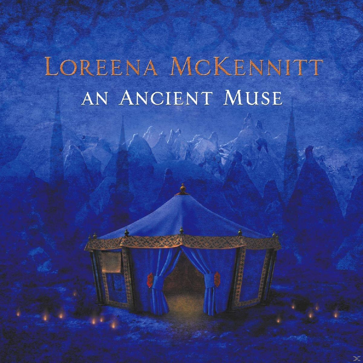 Loreena McKennitt "An Ancient Muse" albumának borítója, kék sátorral és háttérrel.