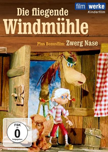 Cover des Animationsfilms. Ein Mann, eine Frau und ein Mädchen stehen vor einem Haus. Titel: Die fliegende Windmühle.