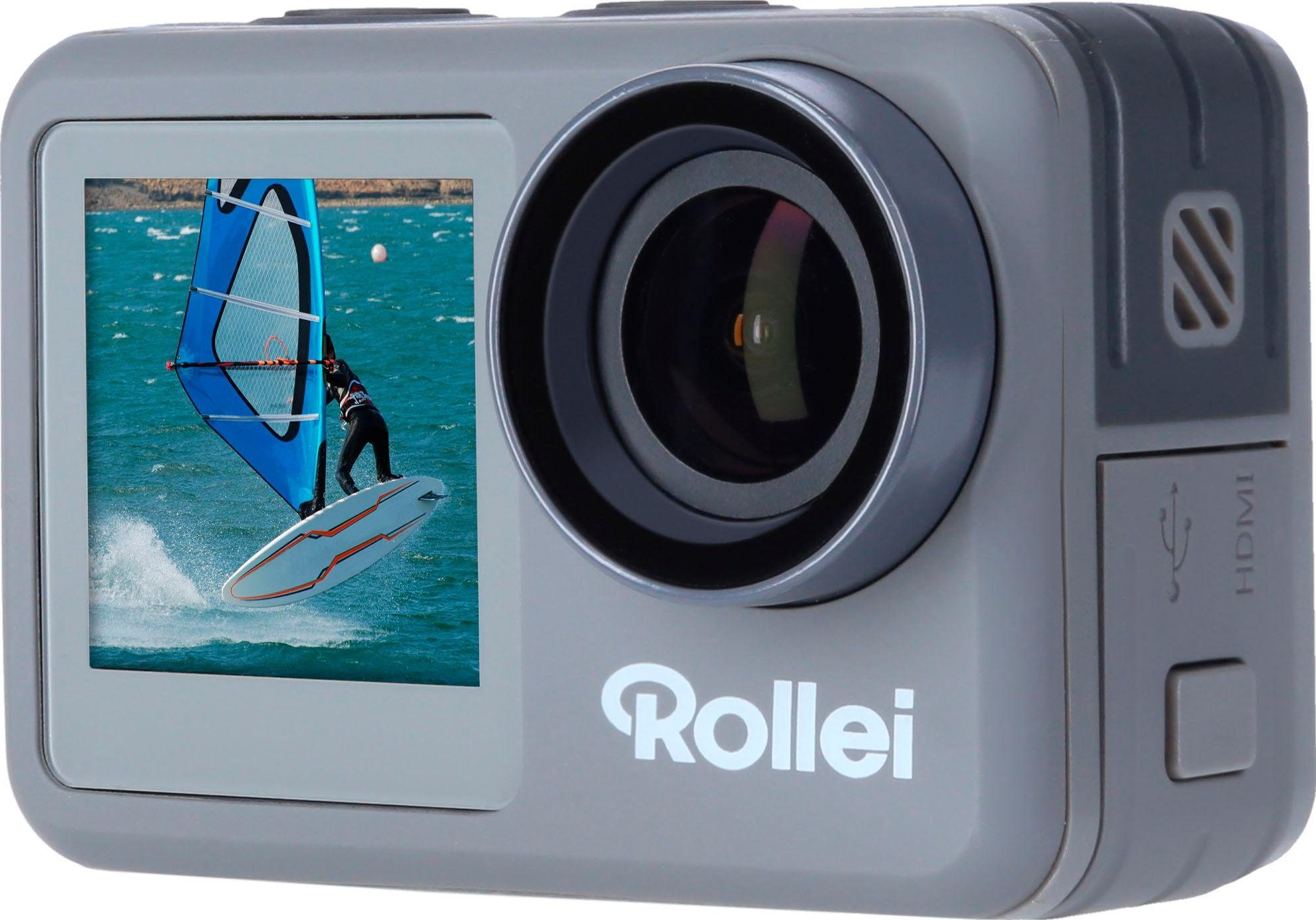 Videocamera Rollei grigia. Mostra una persona che fa windsurf su un mare blu nel display.
