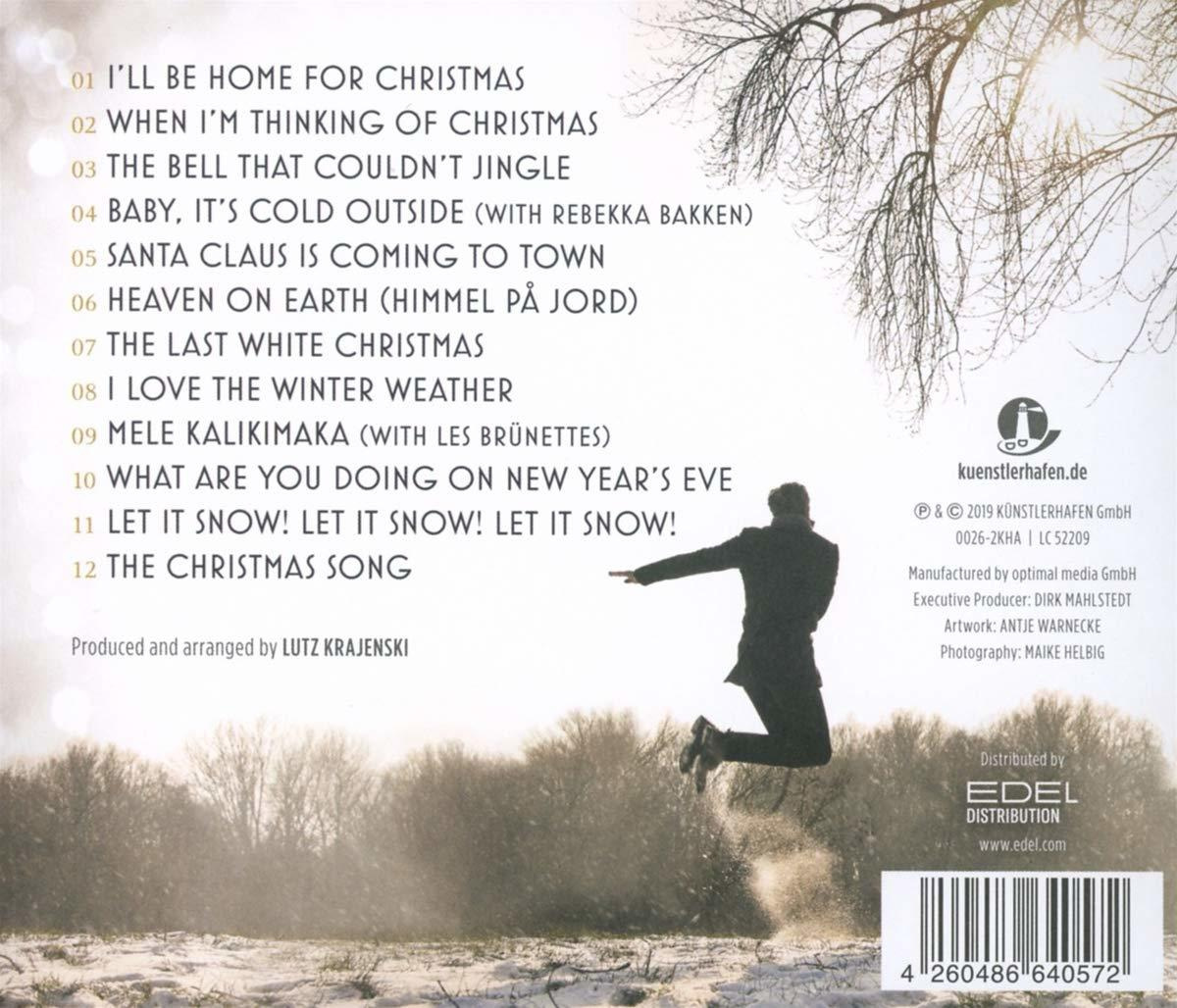 CD-Cover mit einer springenden Silhouette, Winterszene, Titelliste und Text.