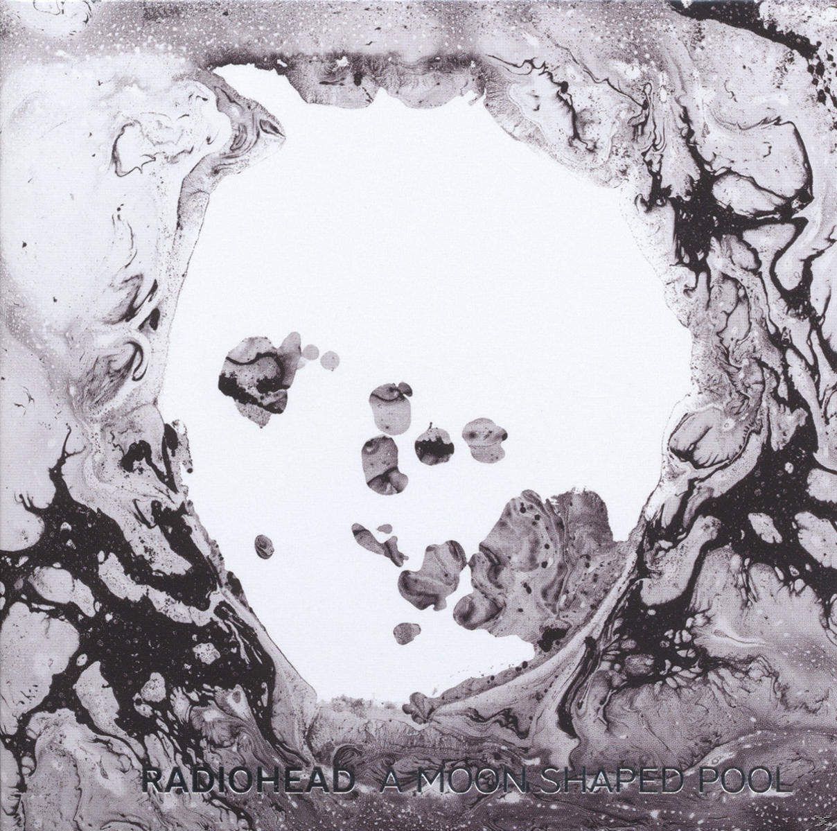 Album borító: Absztrakt fekete-fehér design, középen kör alakú formával. Szöveg: Radiohead.