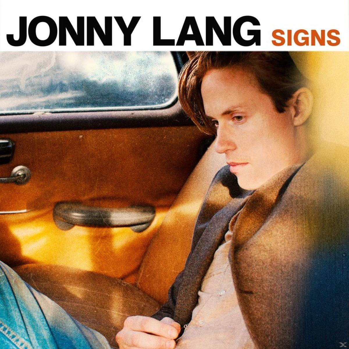 'Jonny Lang Signs' album borítója, egy férfival egy autóban, aki gondolkodó.