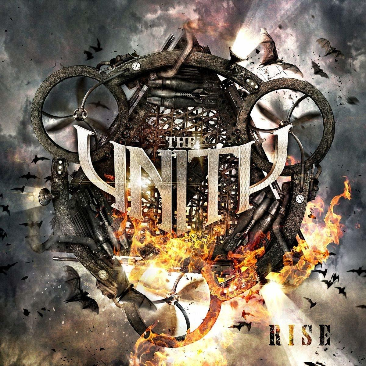 Album borítója. Fém szerkezet propellerekkel, tűzzel, denevérekkel és 'THE UNITY RISE' felirattal, sötét, felhős égbolton.