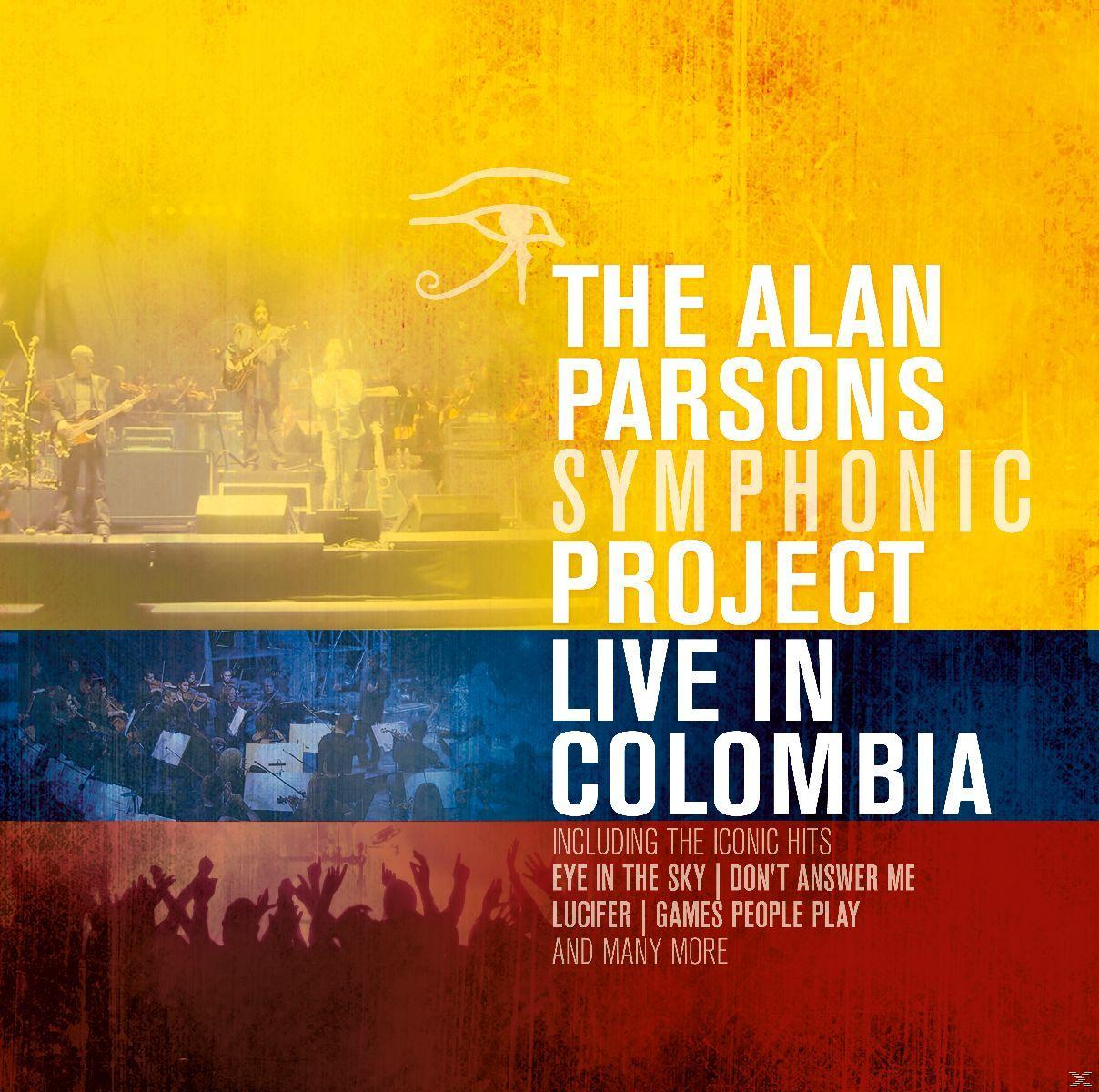 Konzertplakat. Gelbe, blaue und rote Farben. Text: „The Alan Parsons Symphonic Project Live in Colombia“.