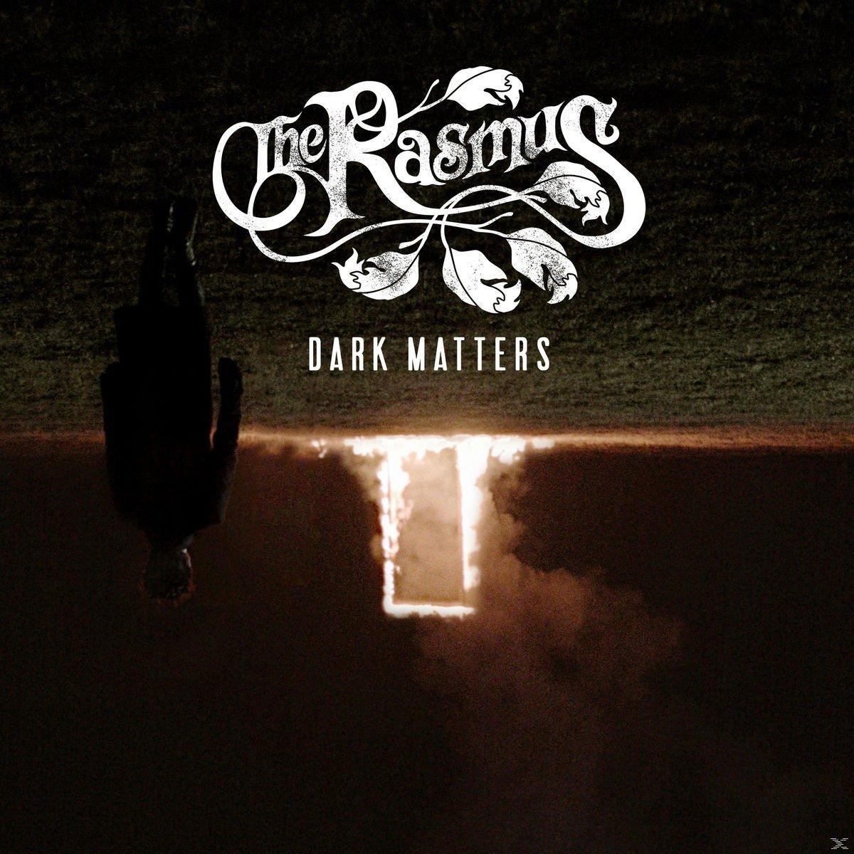 Albumcover mit einer Figur, die in ein helles Licht fällt. Bandname ist The Rasmus, Album 'Dark Matters'.