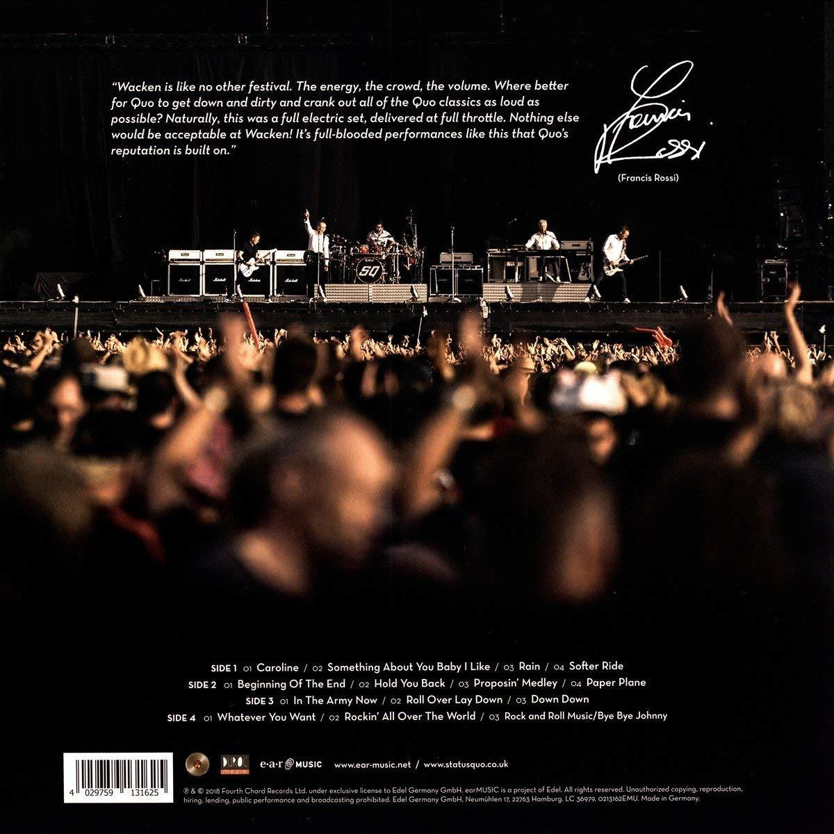 Album-Rückseite: Band auf der Bühne, Publikum und Titelliste.