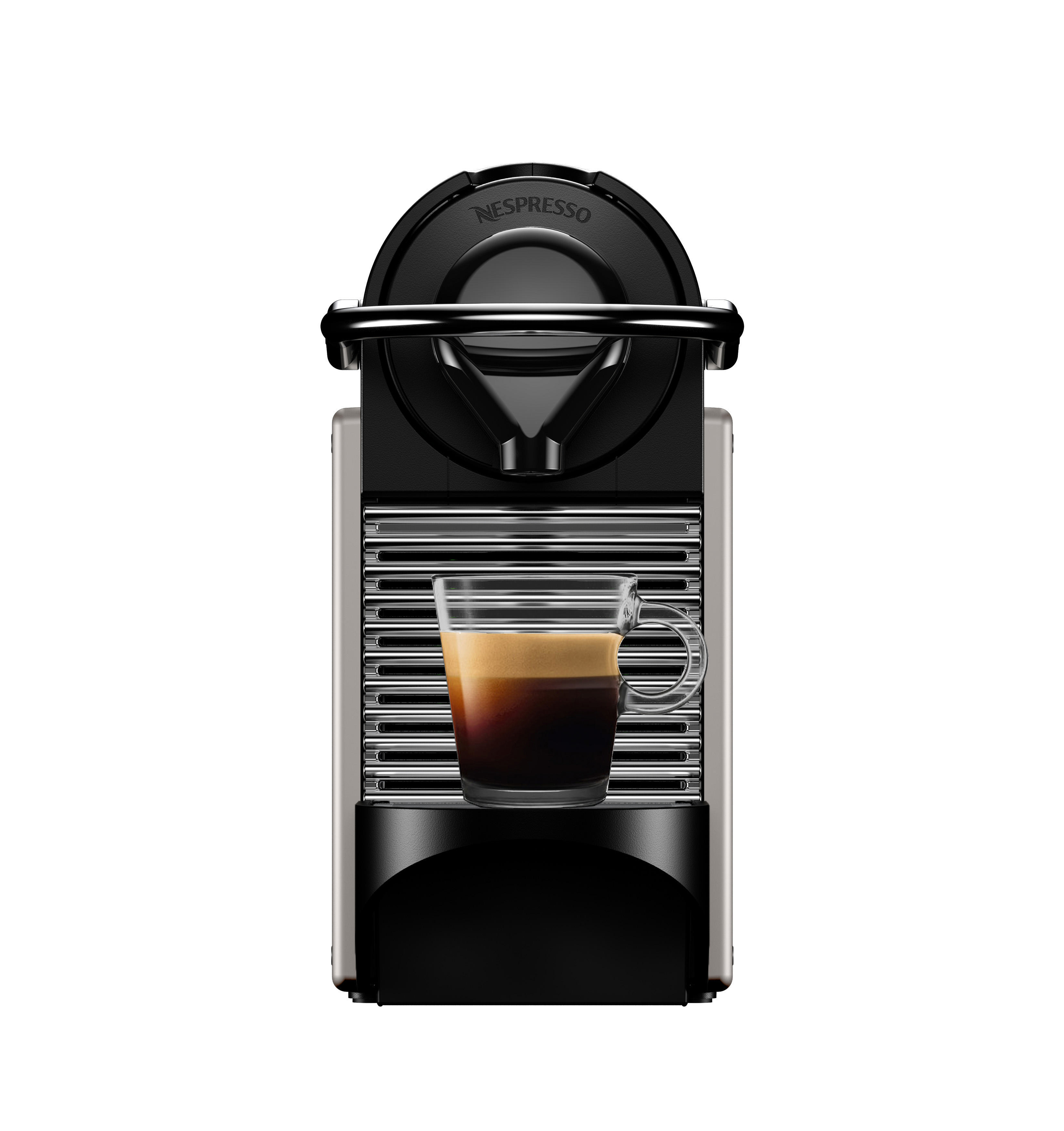 Nespresso Kaffeemaschine mit einer Glastasse Kaffee.