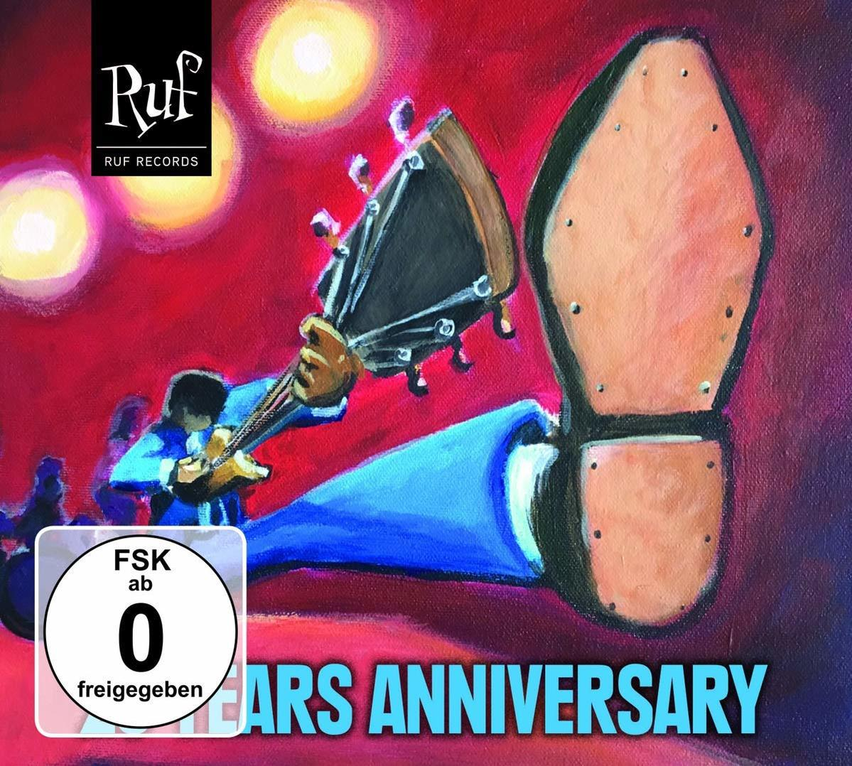 Albumcover mit Gitarre, Stiefel und Text. Rote, blaue und gelbe Farben sind vorhanden.