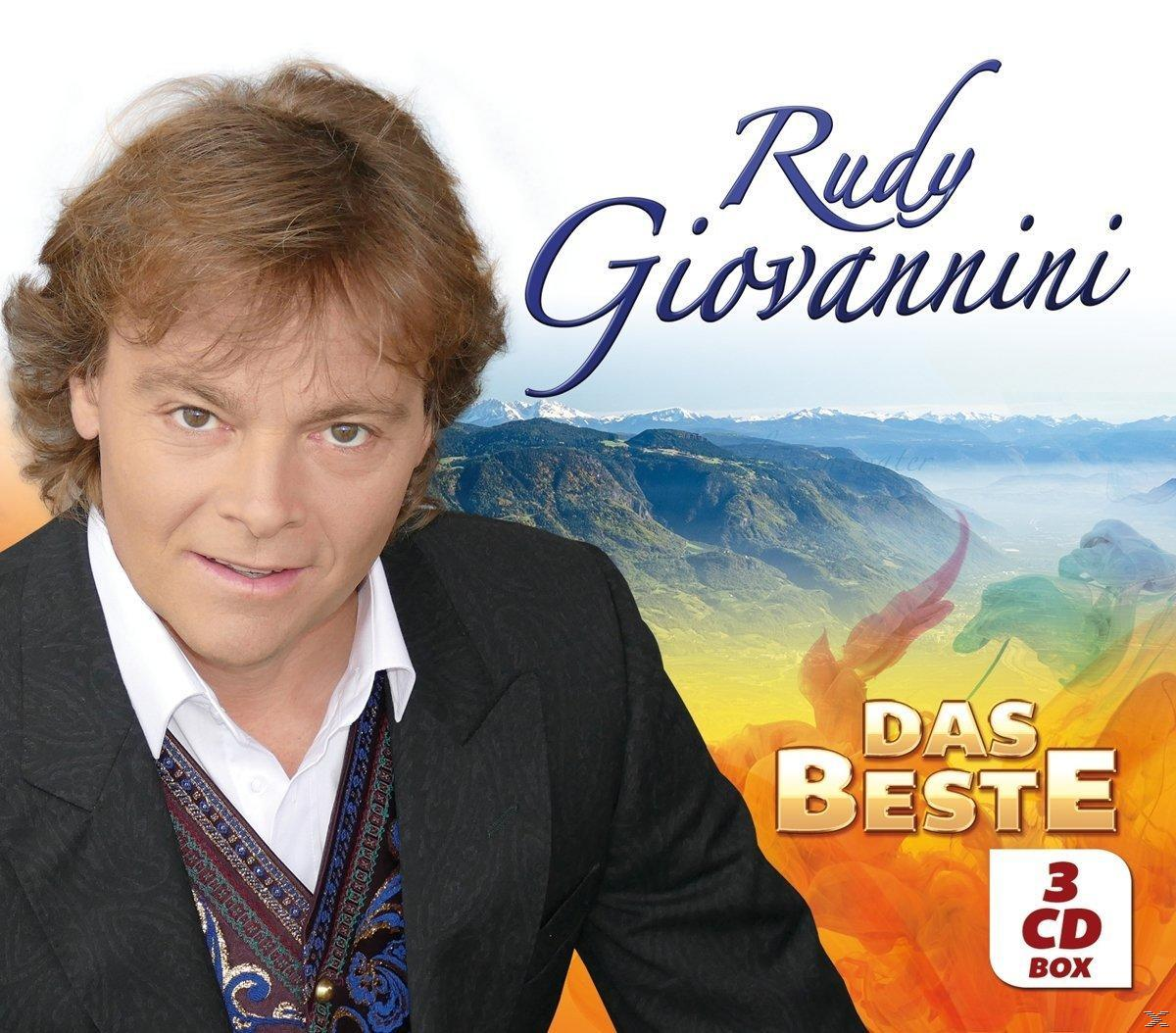 Albumcover von Rudy Giovannini, Mann lächelt, Berglandschaft, Text "Das Beste".