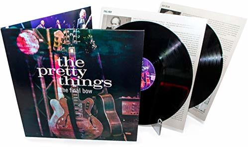 Albumcover mit Gitarre, Schallplatten und Text. Enthält ein Bandfoto und einen weißen Hintergrund.