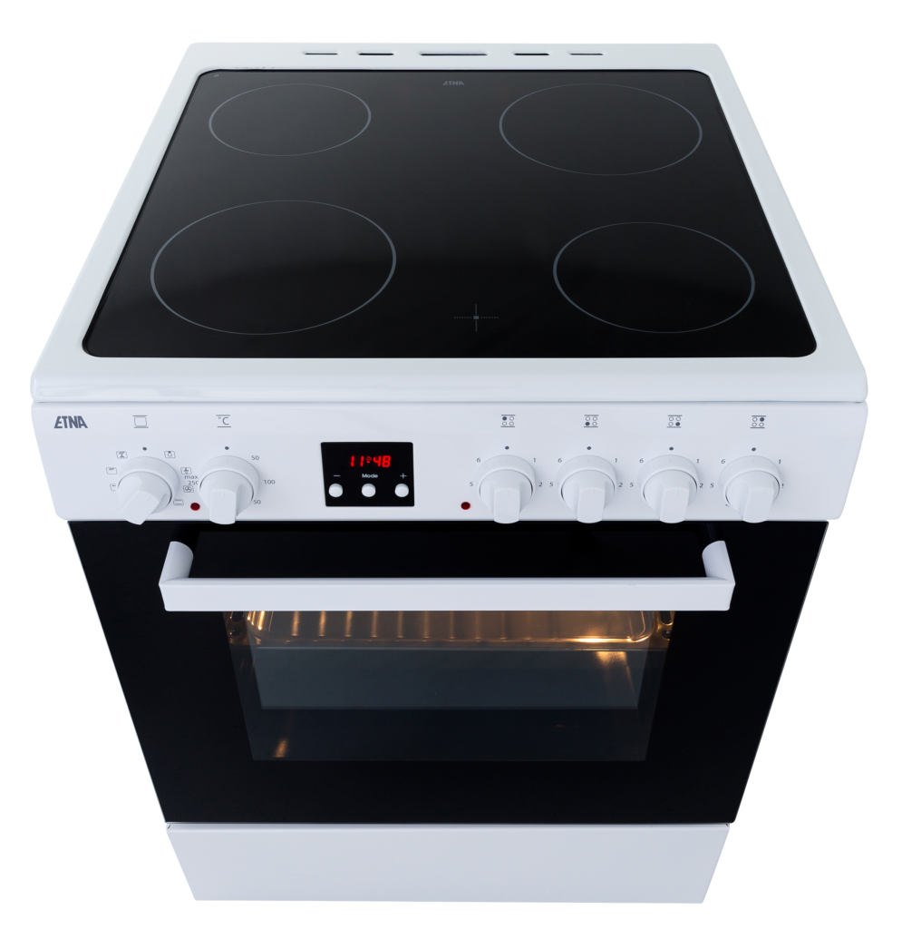Cuisinière électrique blanche avec quatre cercles noirs. Four en dessous avec porte vitrée noire.