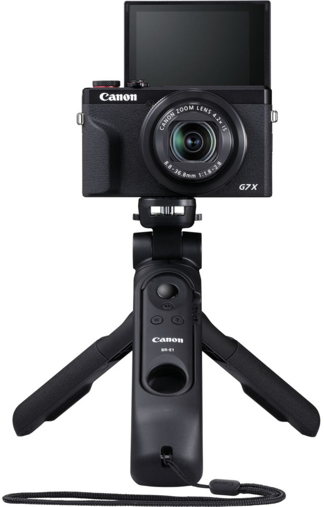 Een zwarte Canon camera met een statief en een handgreep.