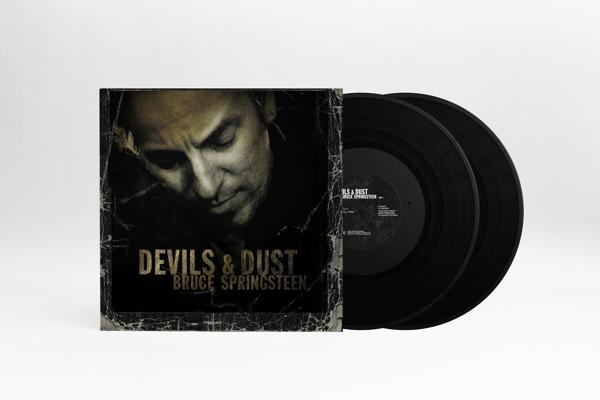 Album cover with a photo of Bruce Springsteen. Black vinyl records are on the right.