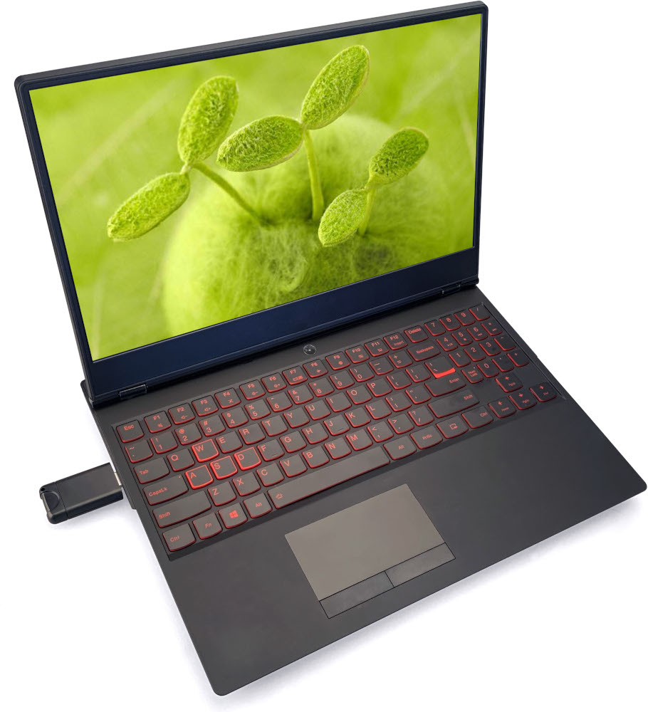 Black laptop with red backlit keyboard, green screen, and USB drive.