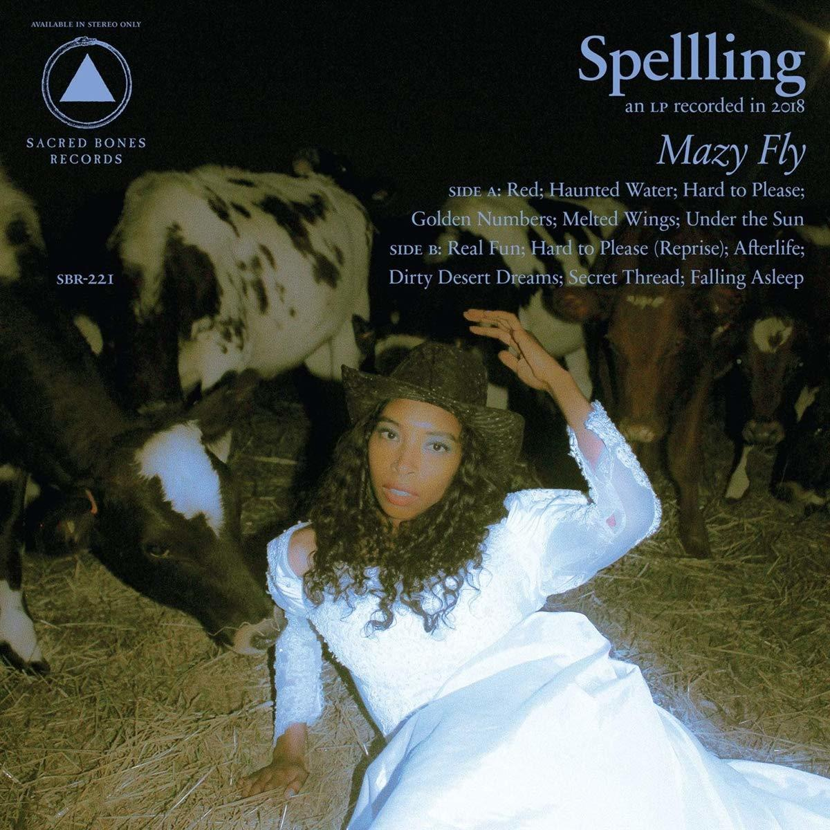 Albumcover mit einer Frau in einem weißen Kleid, Kühen und dem Text 'Spelling'.