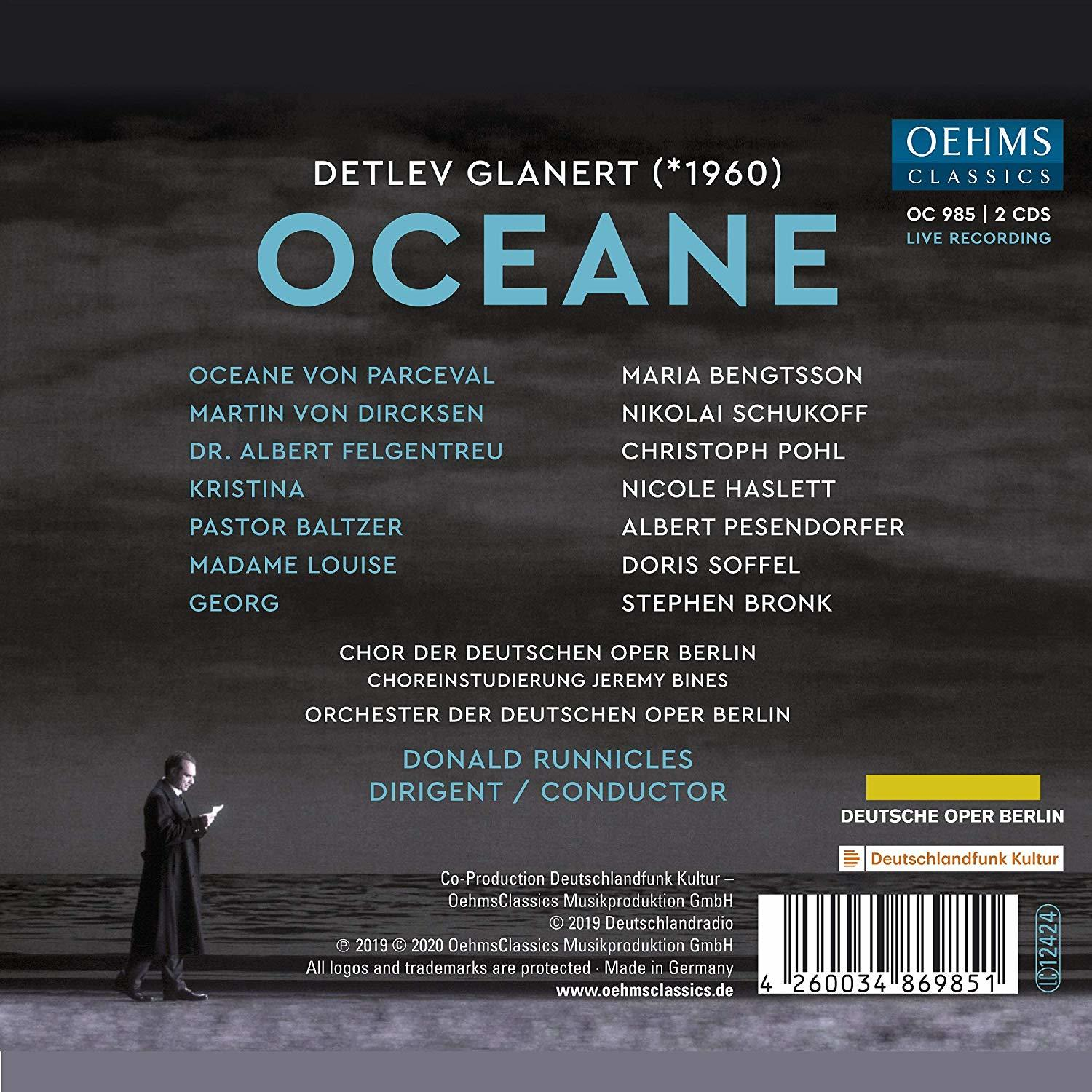 Albumcover mit Text, Namen und einem Dirigentenbild auf dunklem Hintergrund.