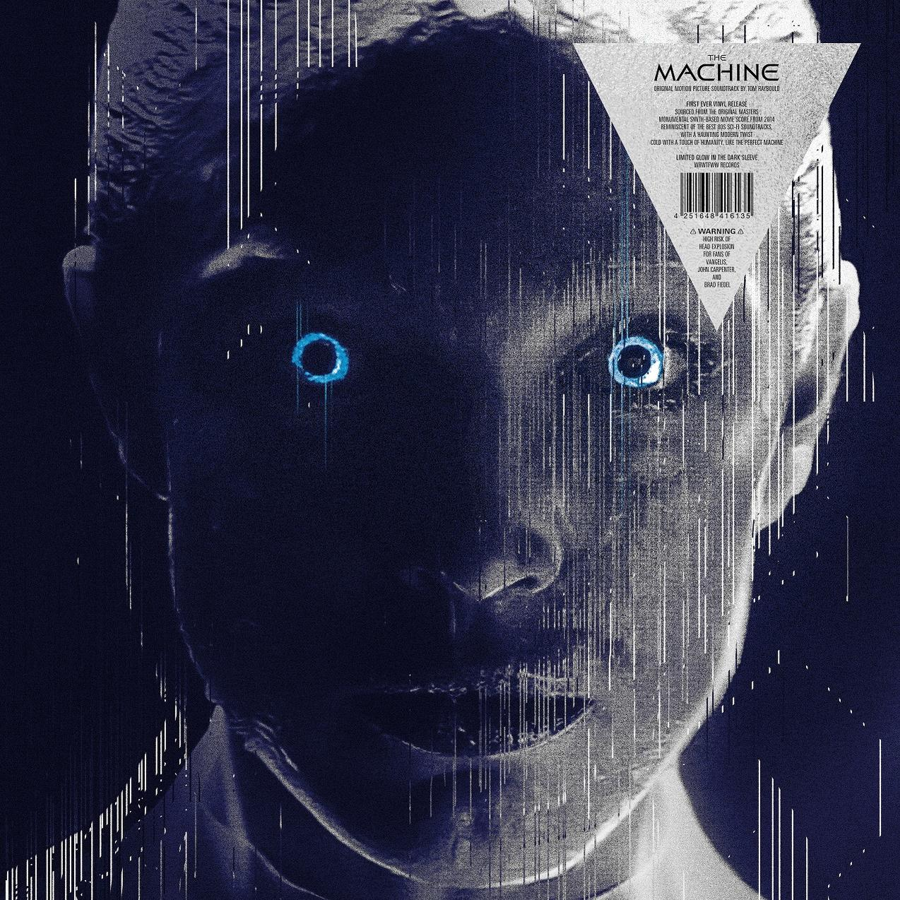 Nahaufnahme eines Gesichts mit blau leuchtenden Augen. Weiße Linien überlagern das Bild. Text 'The Machine' und weitere Details sind sichtbar.