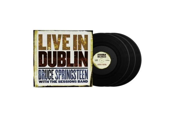 Albumcover mit Bruce Springsteen und Schallplatten auf weißem Hintergrund.