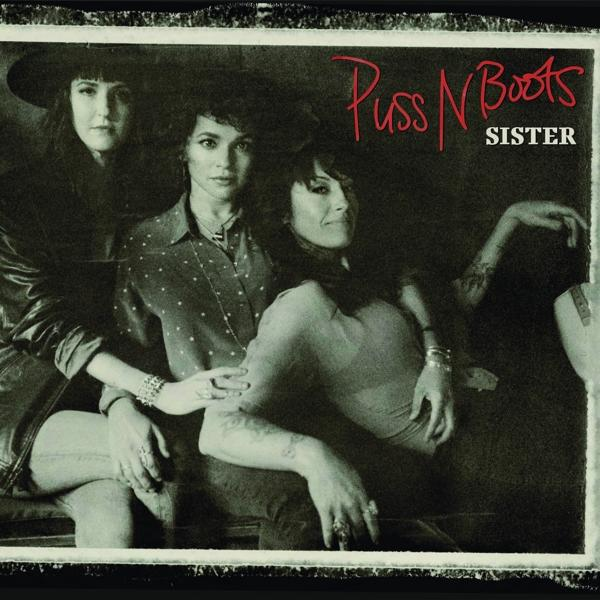 Drie vrouwen poseren, albumhoes. Tekst 'Puss N Boots' en 'Sister' in rood.