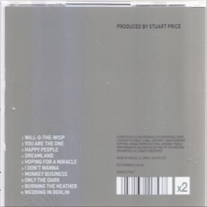 CD-tok hátulja dalcímekkel és Stuart Price producerrel. Vonalkódot és 'x2' jelzést tartalmaz.