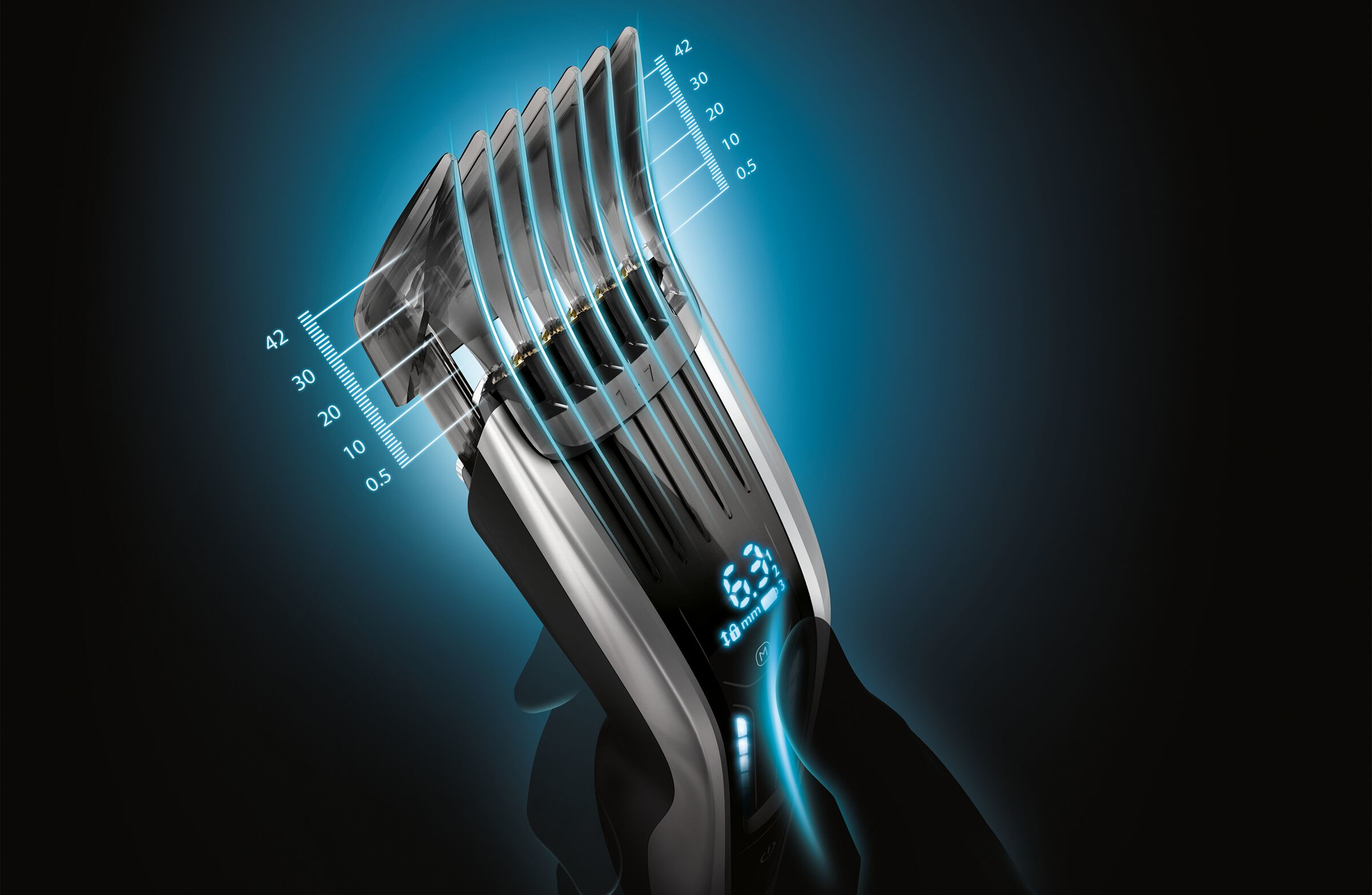 Close-up of a black and silver hair clipper with blue light details.