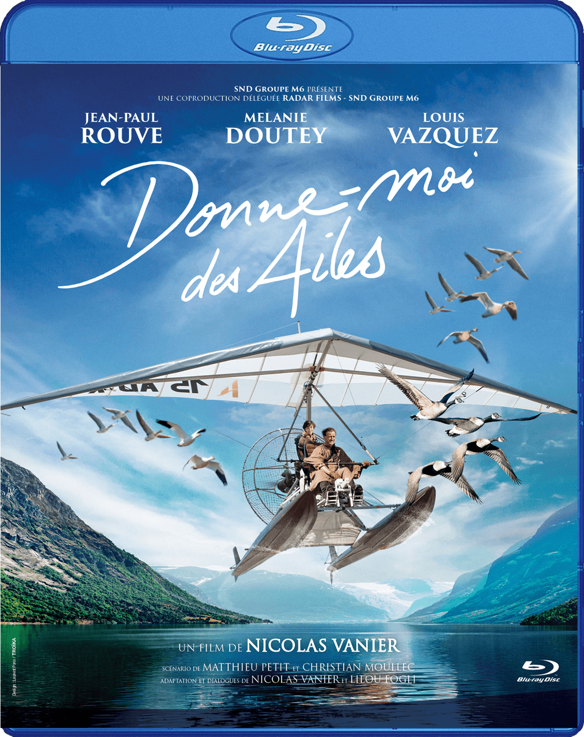 Couverture Blu-ray: Donne-moi des Ailes, avec des gens dans un planeur et des mouettes volant.