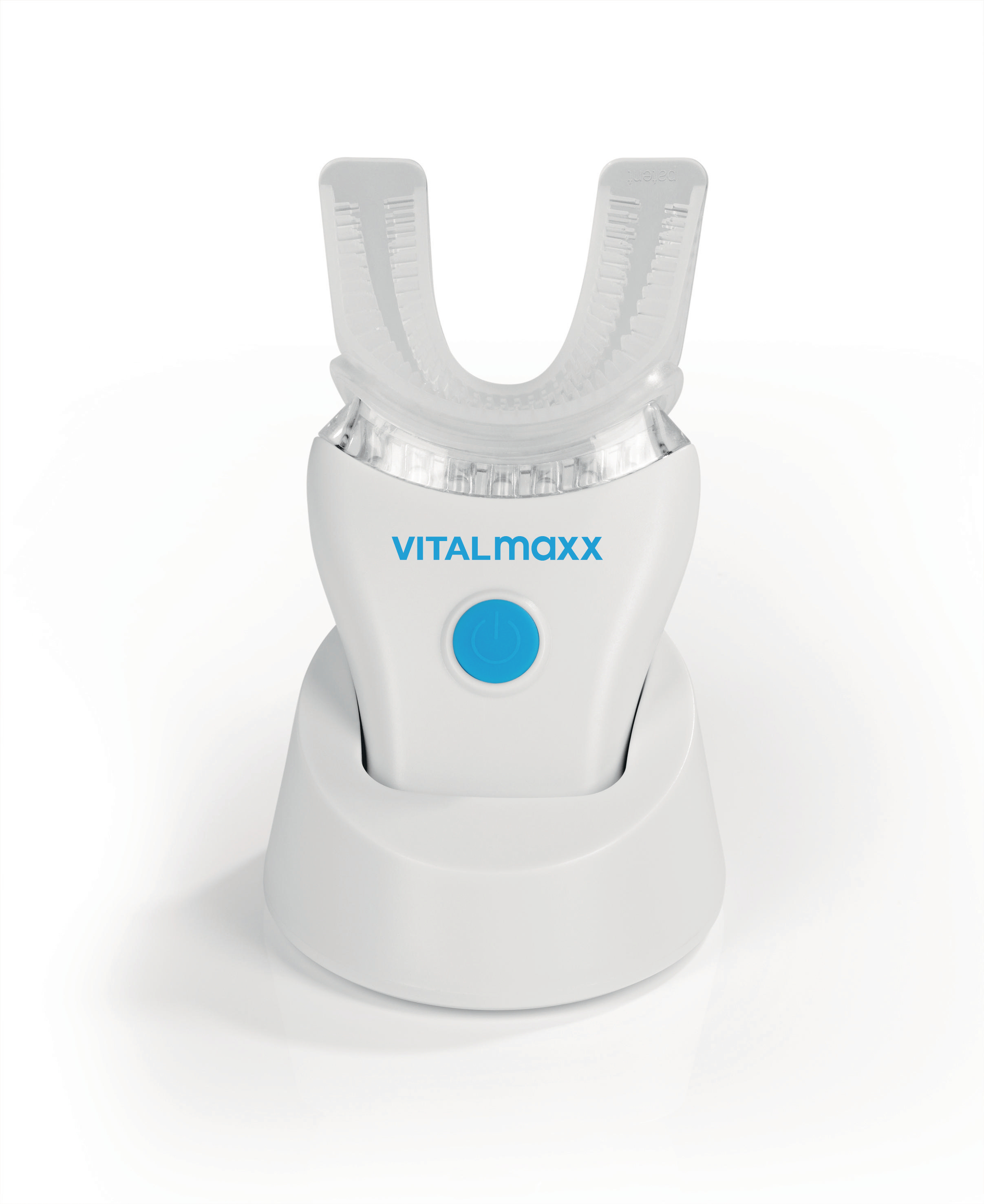 Eine weiße elektrische Zahnbürste von VITALmaxx auf ihrer Ladestation.