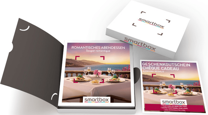 Confezione regalo con scena cena romantica. Scatola aperta con due carte, una con immagine di ristorante.