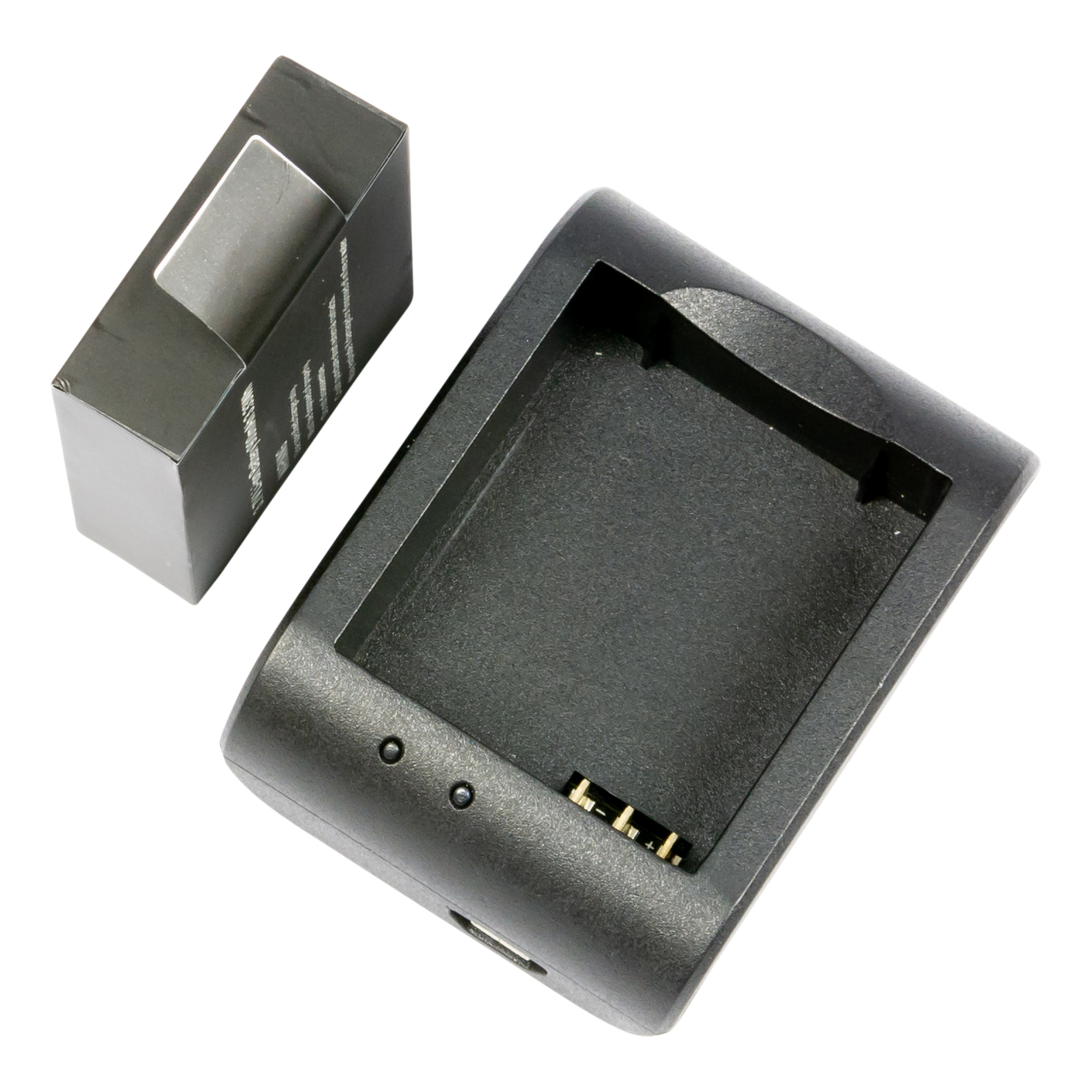 Zwarte oplader en doos voor een camera-accu.