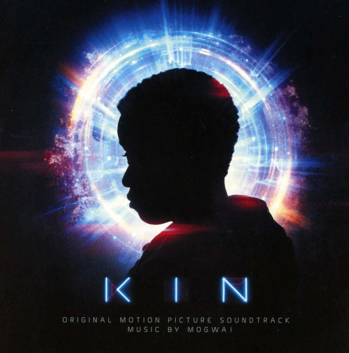 Albumcover für 'KIN' Soundtrack. Silhouette einer Person in einem blauen Kreis. Blauer 'KIN' Text.