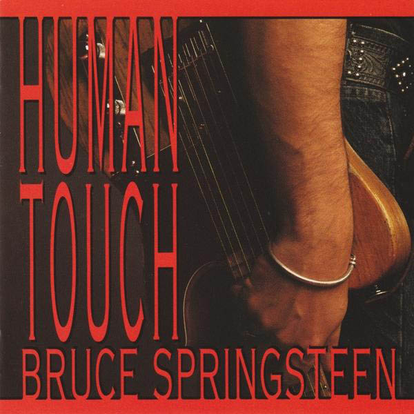 Albumcover: Hand hält Gitarre mit Text 'HUMAN TOUCH' und Künstlername 'BRUCE SPRINGSTEEN'.