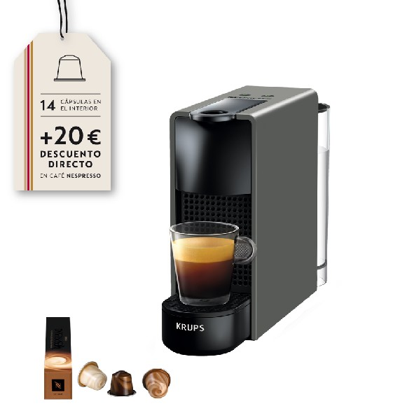 Una cafetera Krups gris con una taza de café y una etiqueta.