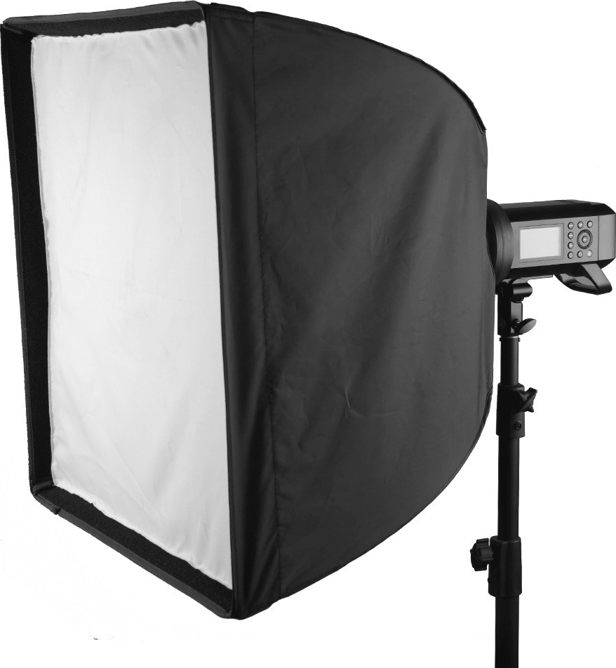 Une configuration d'éclairage de studio, comprenant une lumière et une boîte à lumière sur un pied.
