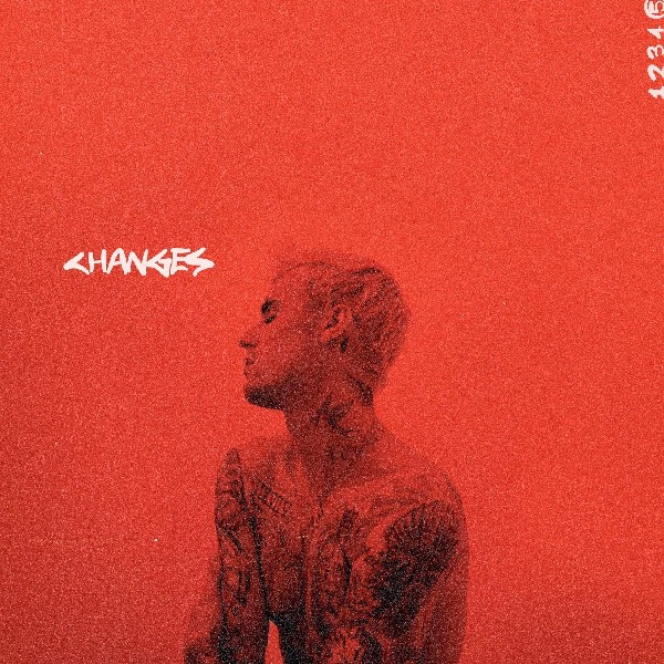 Portada del álbum Changes de Justin Bieber. Fondo rojo y su perfil.
