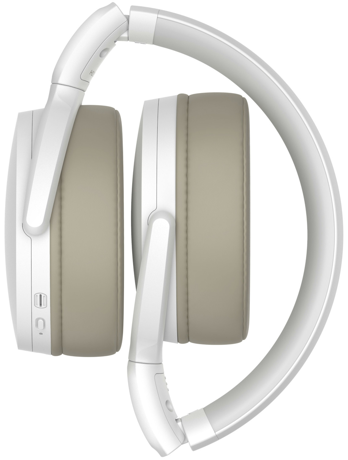 Casque blanc plié avec des oreillettes grises et un port de charge noir.