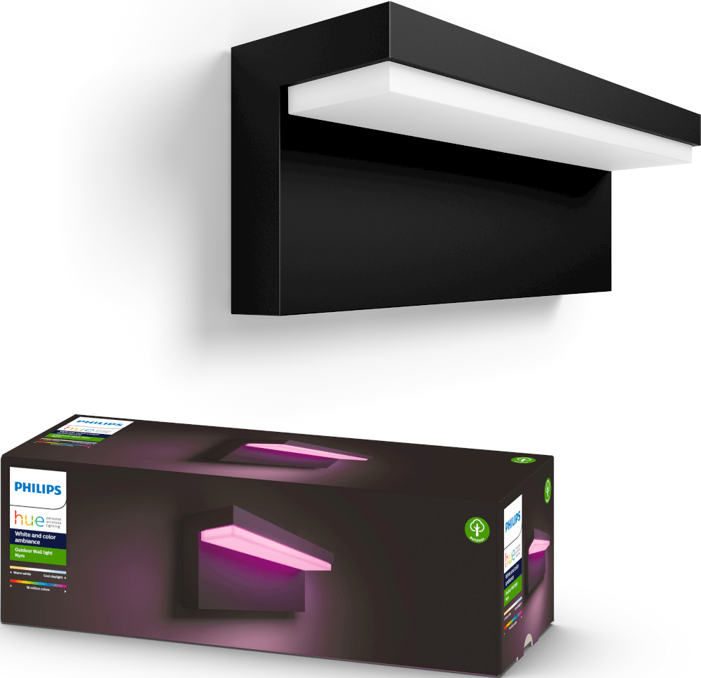 Schwarze Außenwandleuchte und ihre Box. Die Leuchte ist an einer weißen Wand montiert und strahlt rosa Licht aus.