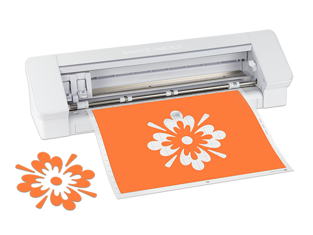 Eine weiße Schneidemaschine schneidet ein orangefarbenes Papier mit einem Blumendesign.