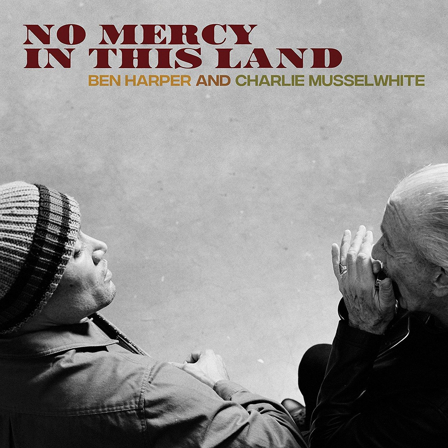 Album borító. Két férfi, egy kalappal, a másik kézzel az arcnál. 'No Mercy In This Land' szöveg.