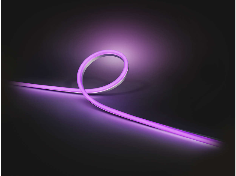 Une bande LED violette flexible se courbe sur fond sombre.