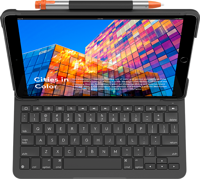 iPad avec étui clavier. Affiche un paysage urbain coloré à l'écran. Stylet est attaché.
