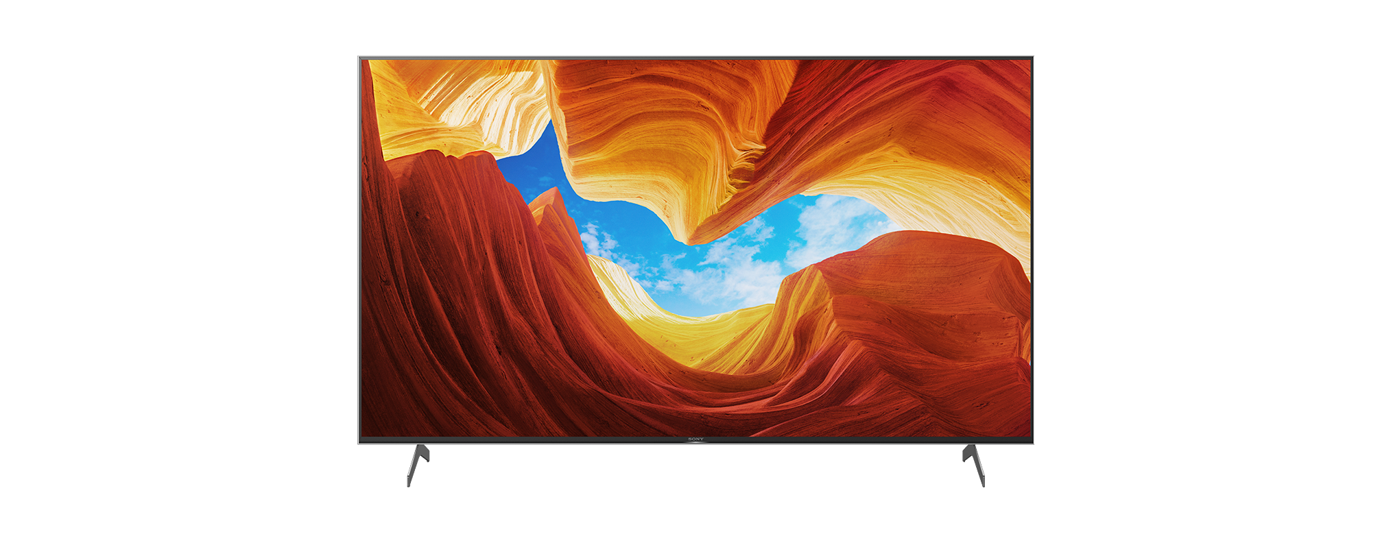 Ein großer Flachbildfernseher mit Canyon-Bild auf schwarzem Hintergrund.