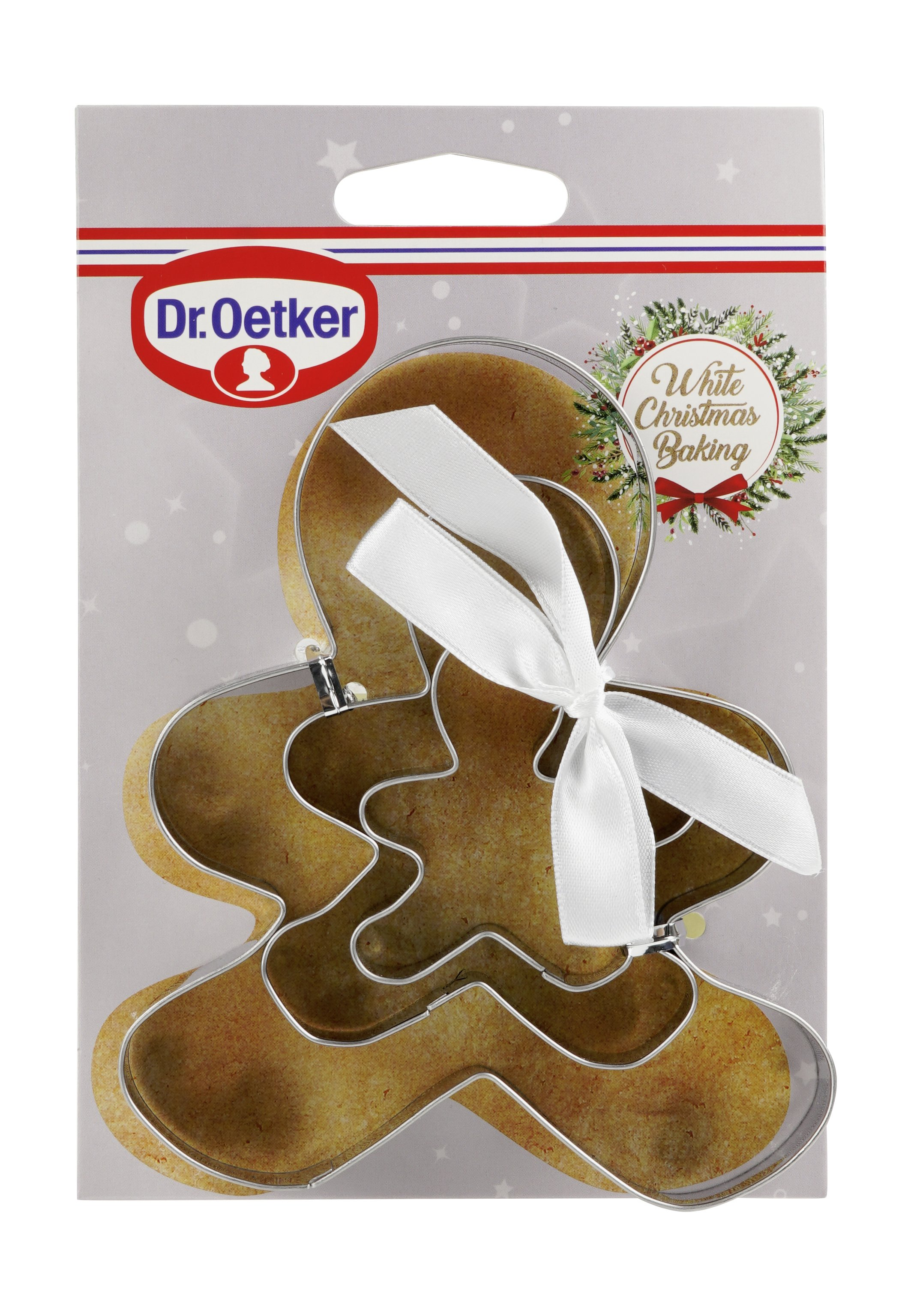 Lebkuchenausstecher-Set mit Schleife auf grauem Hintergrund.