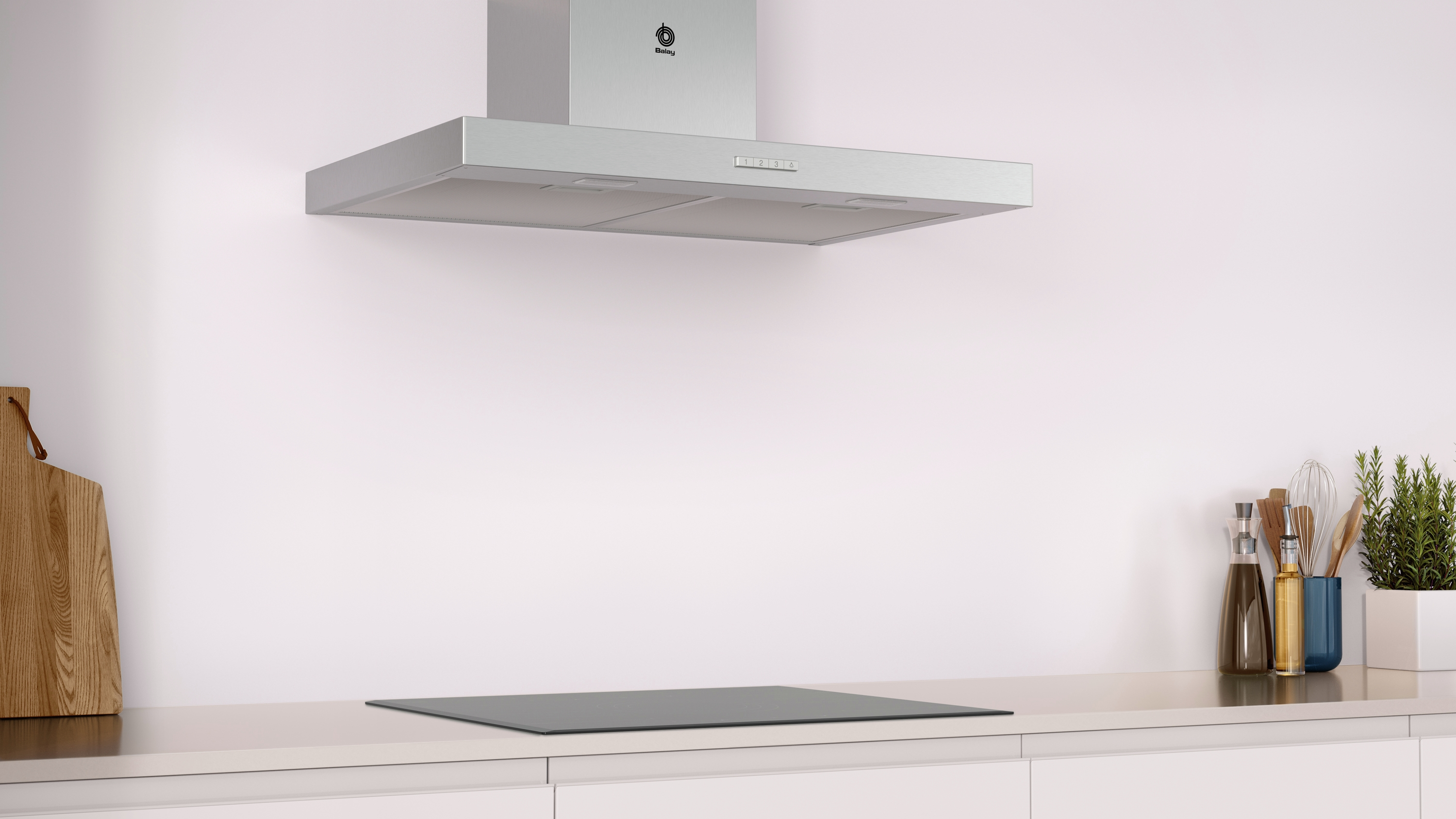 Una campana extractora plateada sobre una placa de cocina gris en una cocina.