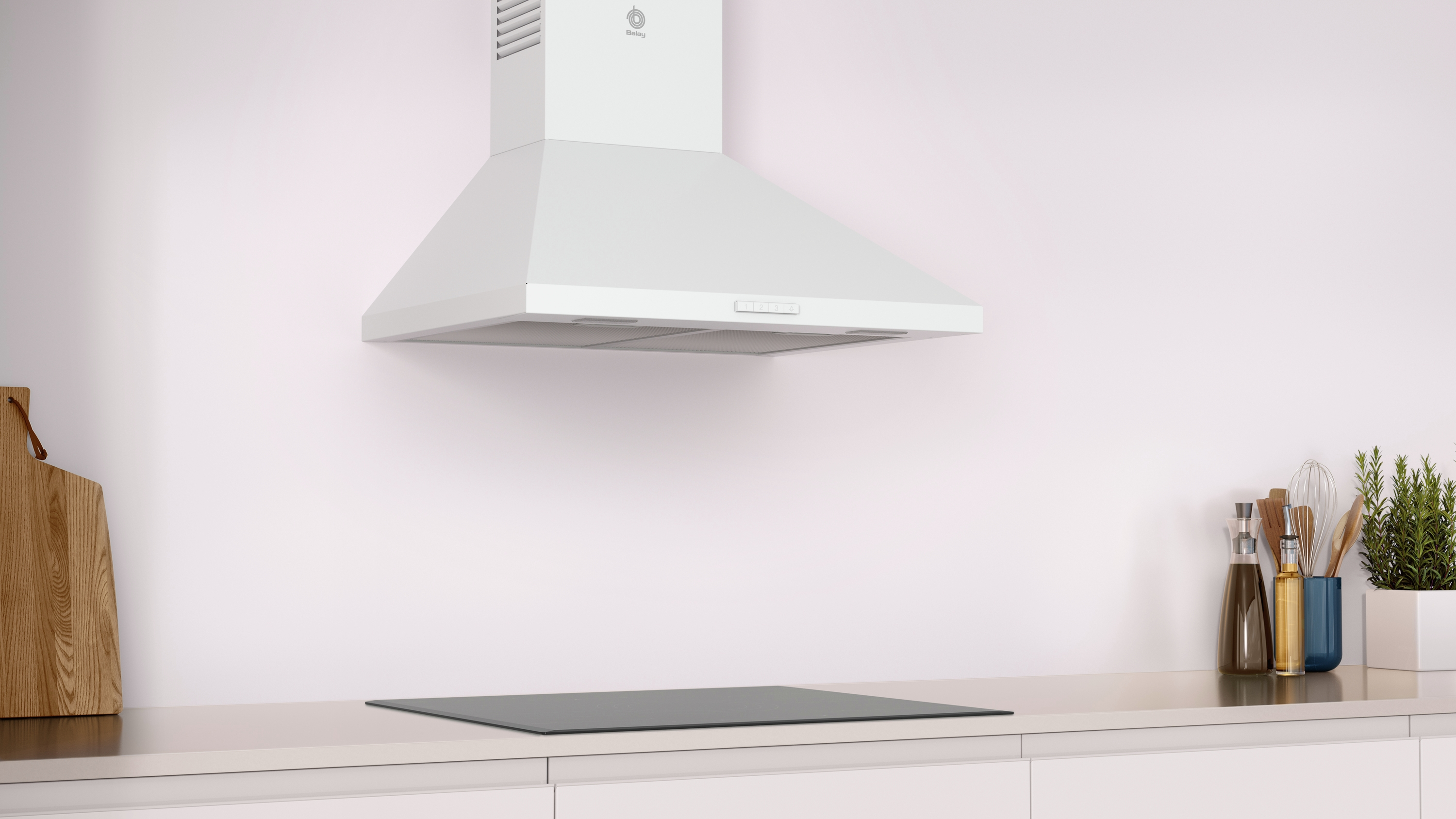 Campana extractora blanca sobre una encimera negra. La cocina tiene encimera y pared blancas.