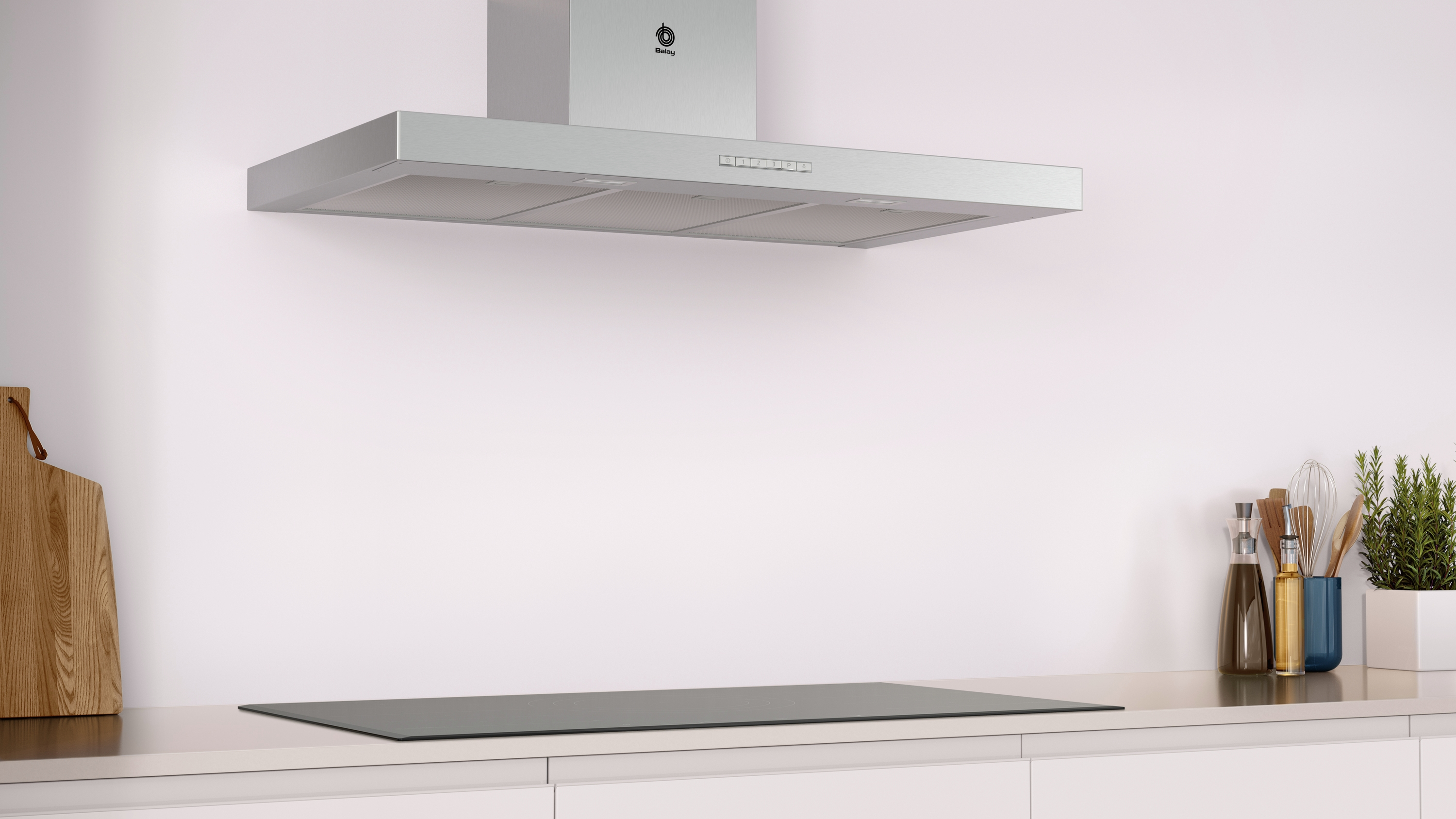 Cocina con encimera blanca, vitrocerámica y campana extractora encima. El fondo es blanco.