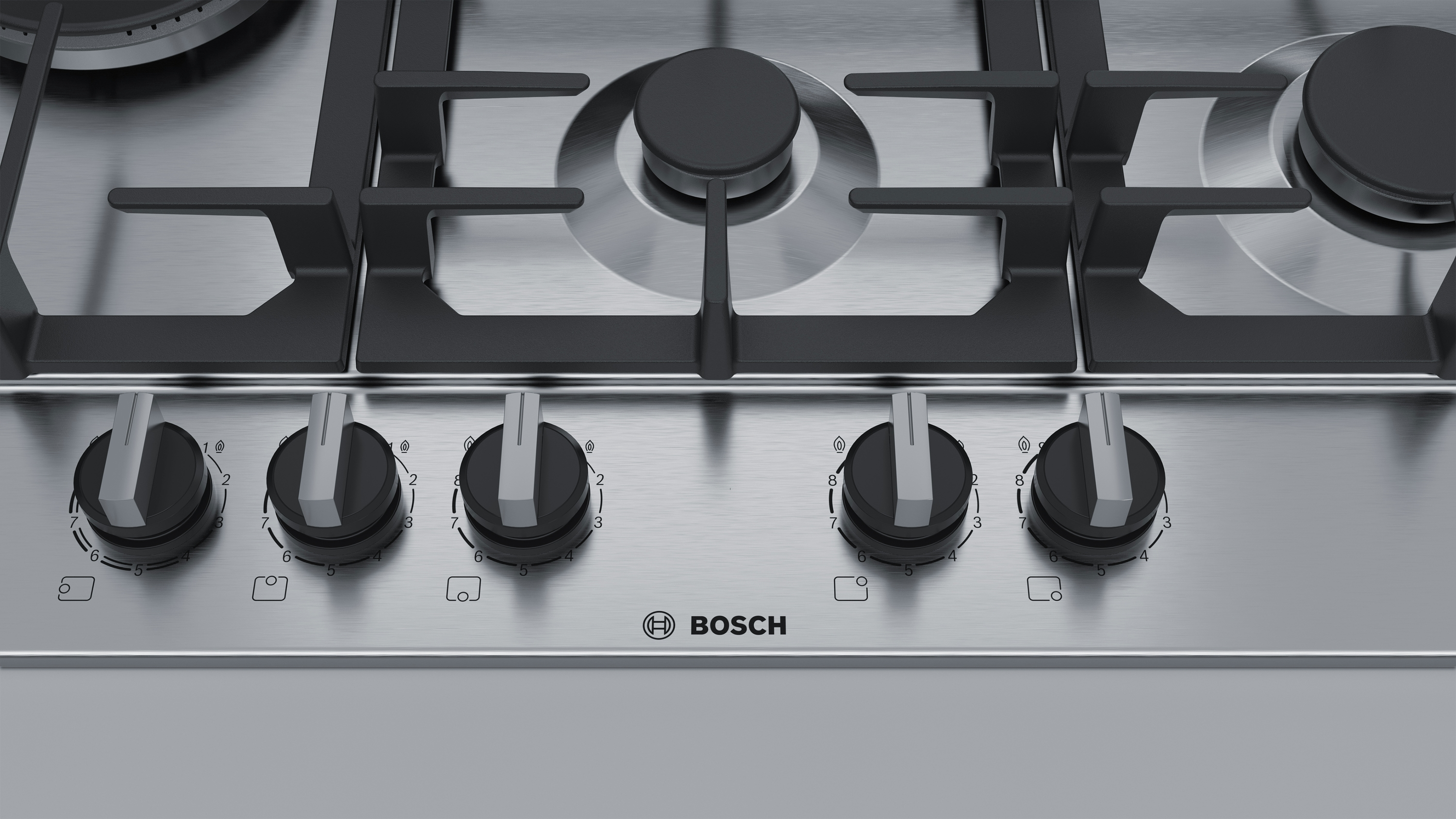 Encimera de gas con mandos, logo Bosch, superficie acero inox.