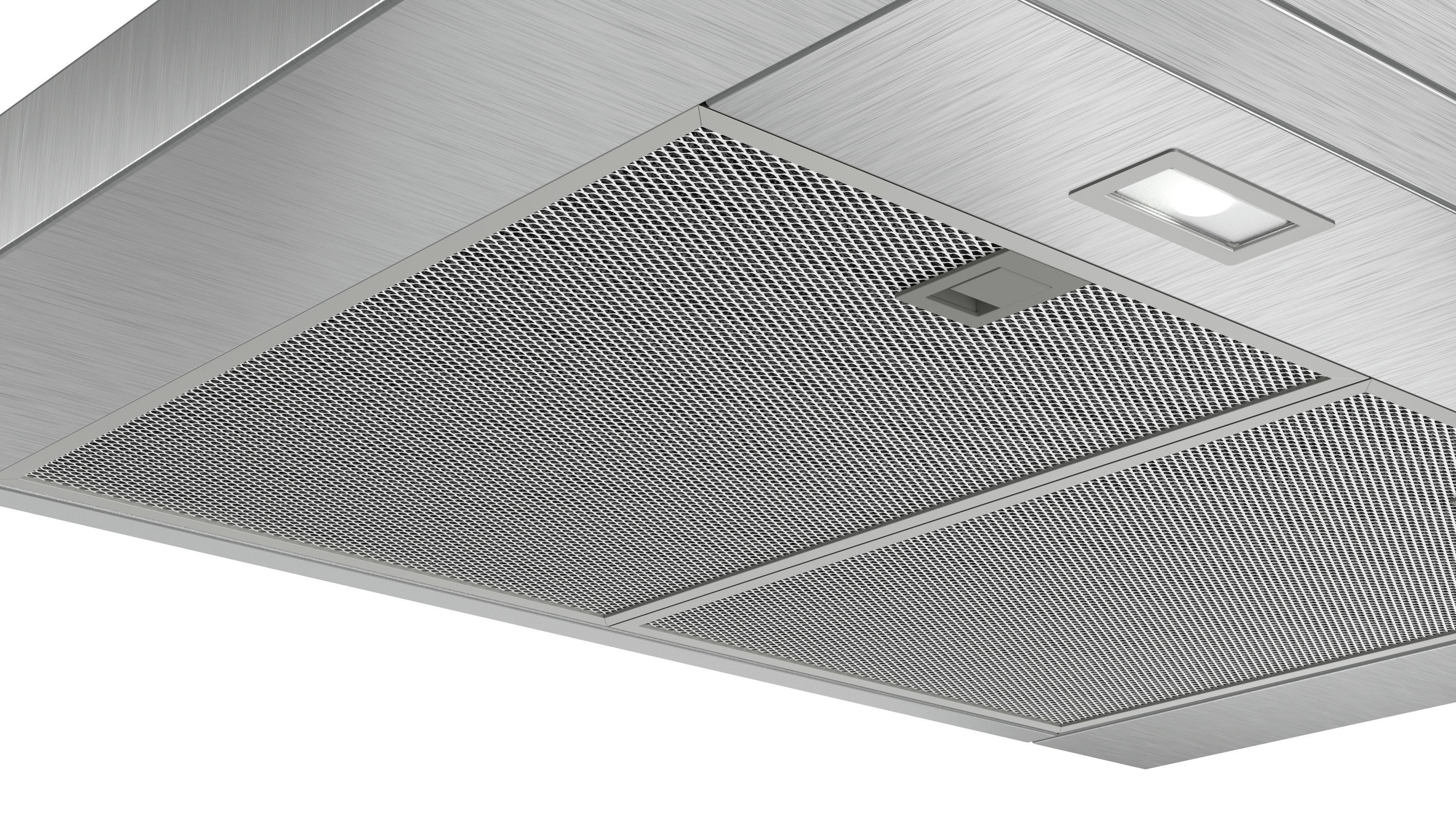 Primer plano de una campana extractora con un filtro de metal y una luz.