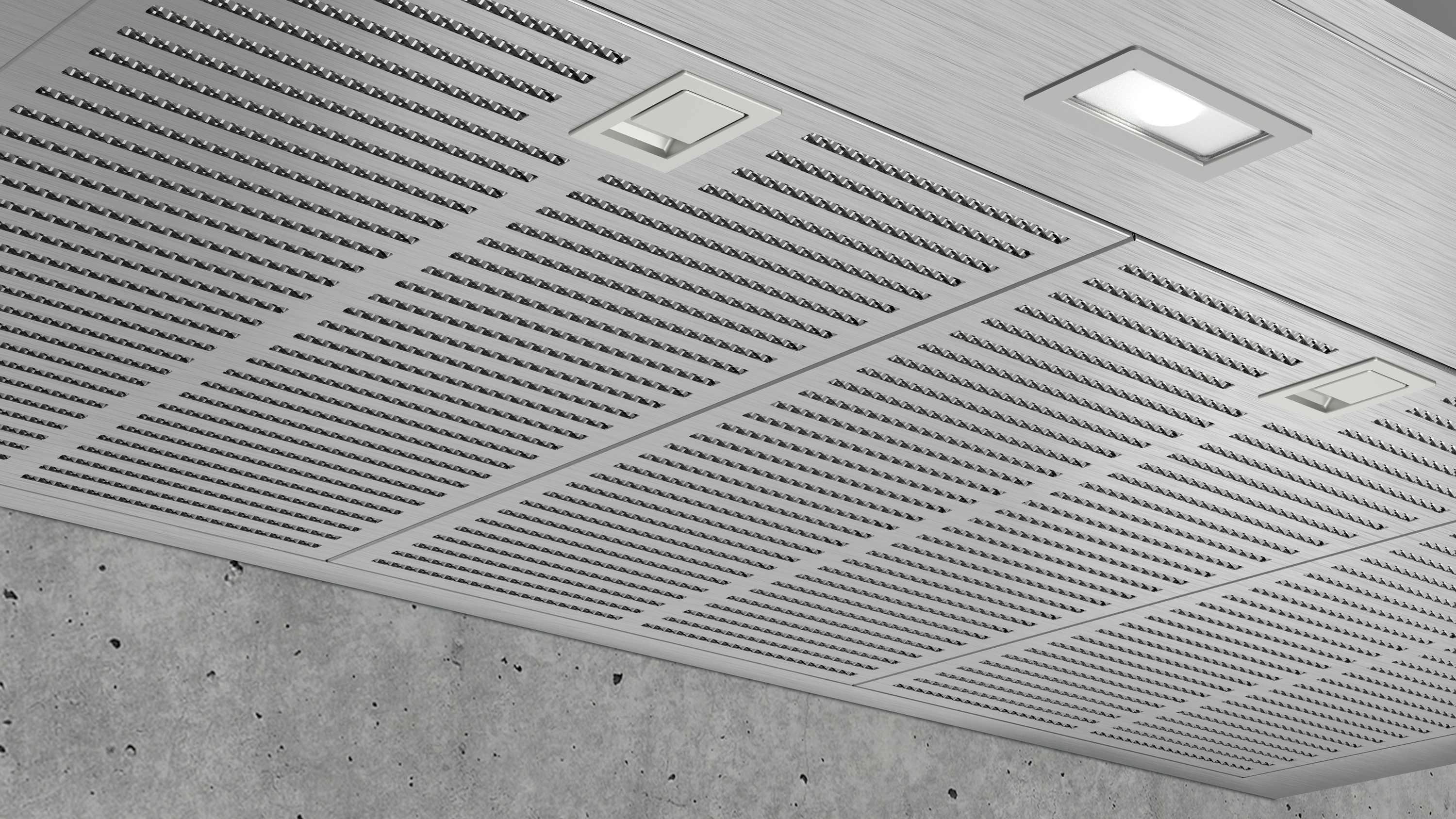 Primer plano de un techo metálico perforado con dos luces empotradas.