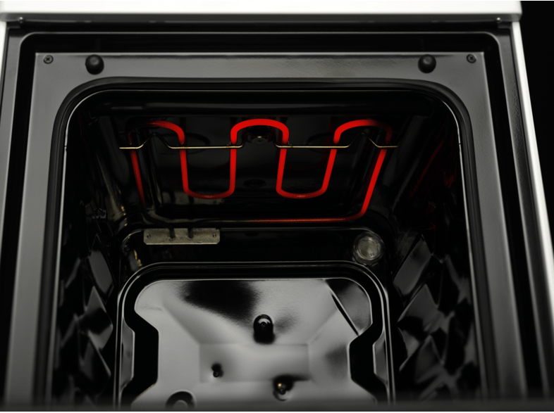 Inside of an oven with heating elements glowing red. Black interior.