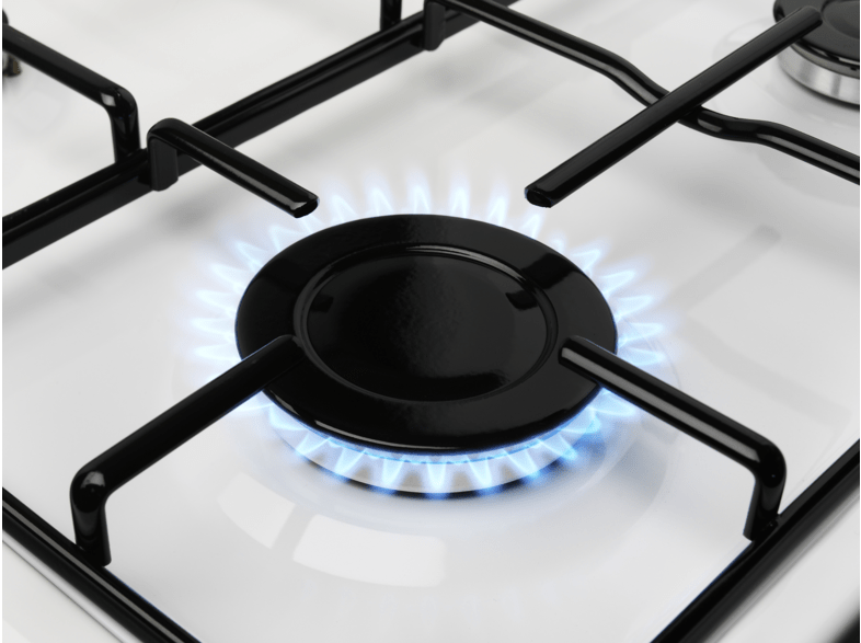 Gas stove burner with a blue flame. Black burner and white stove top.